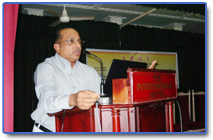 Dr. George P. Abraham  transplant surgeon giving a talk on  the surgical aspects of  