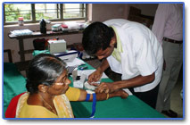 Phlebotomist taking the blood for Phase I  onsite testing at the Camp. 